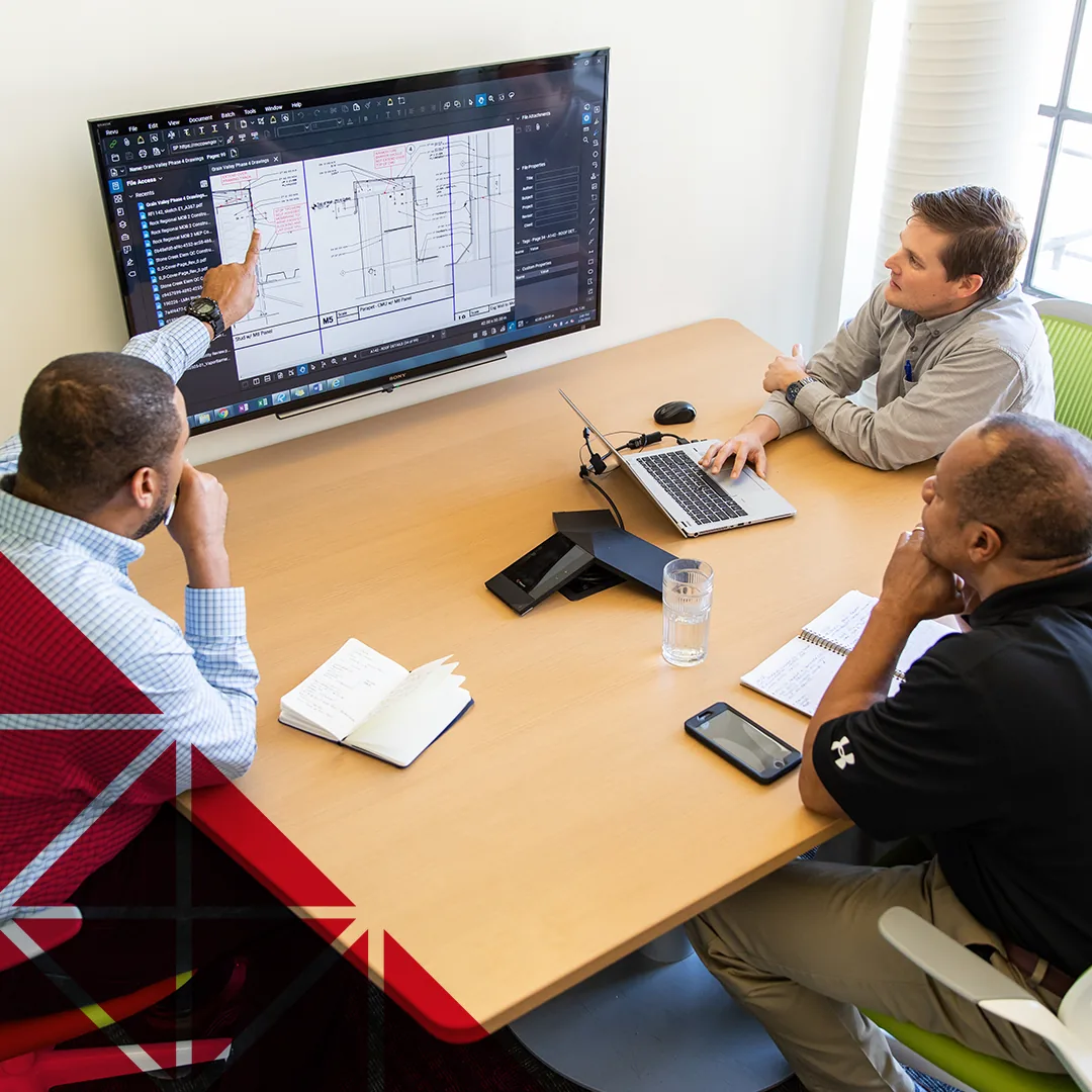 McCownGordon construction associates looking at project plans