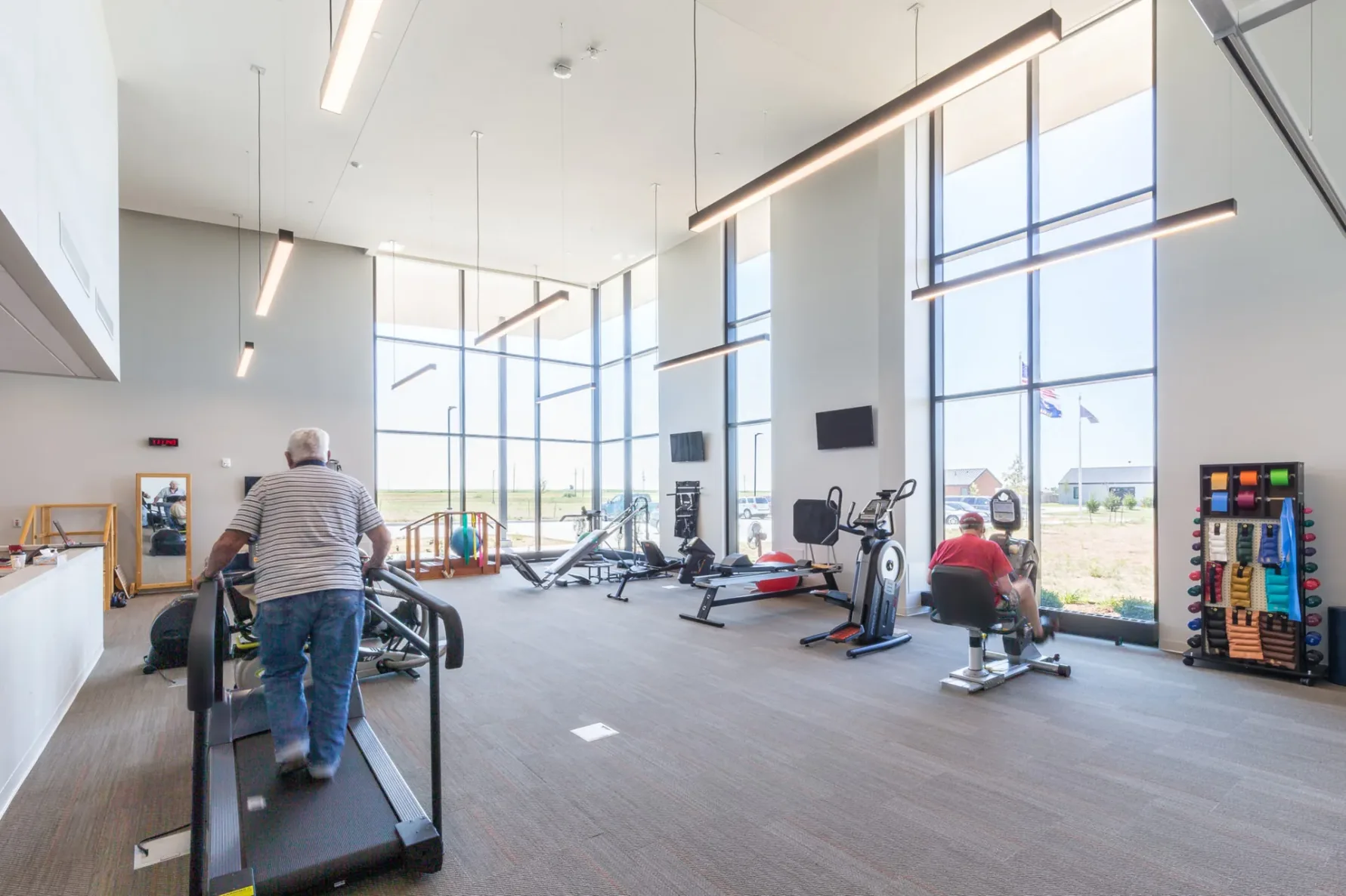 Two men working exercising at health center
