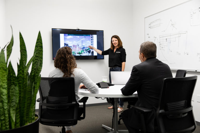 McCownGordon Construction workers discussing a project in the Kansas City office