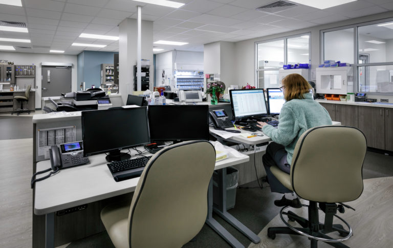 Women working at desk in the new pharmacy addition for Olathe Medical Center