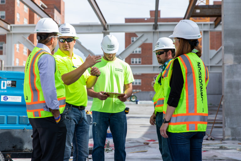 McCownGordon associates collaborating with an owner on a construction site