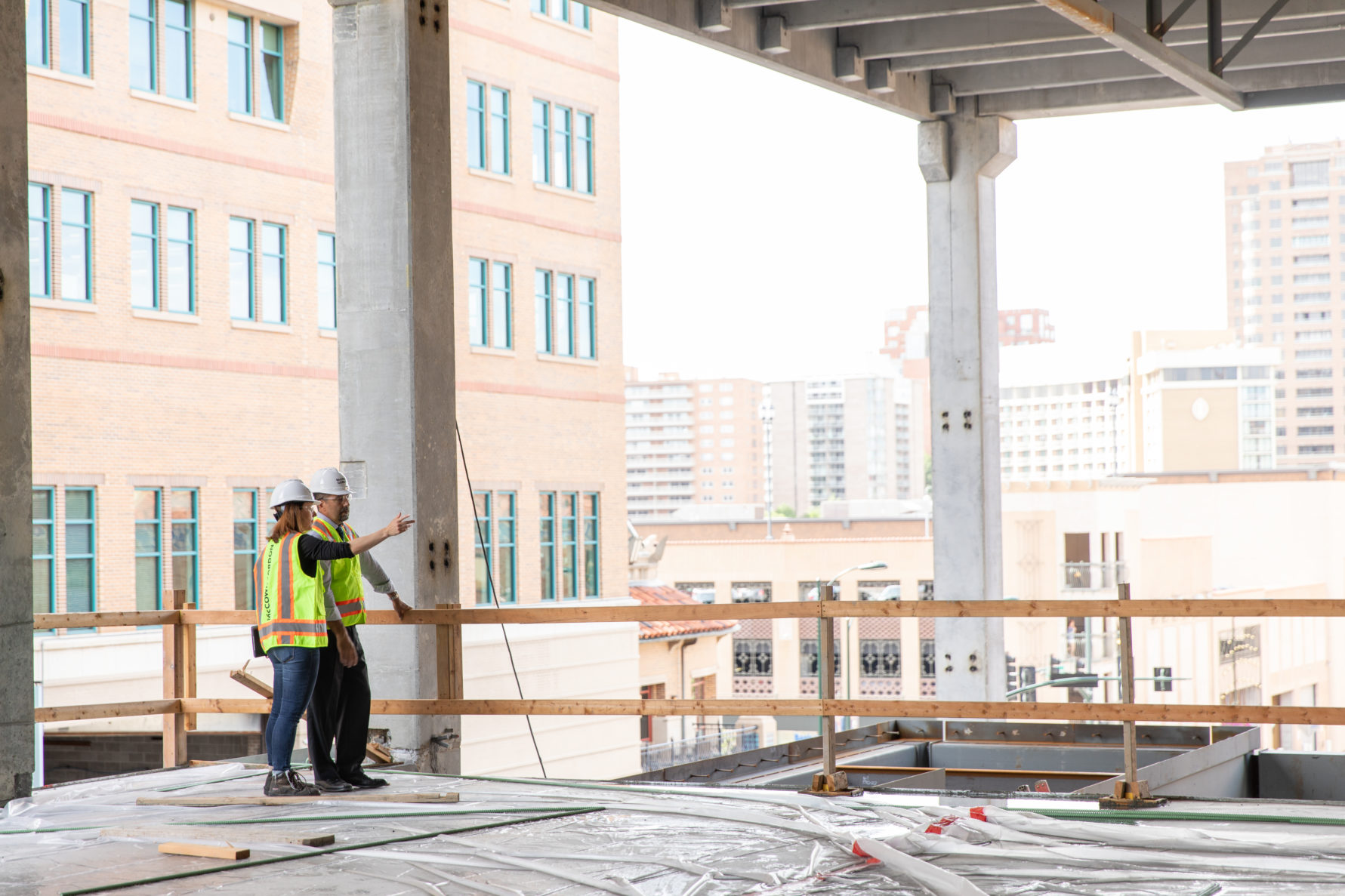 Two people touring a McCownGordon Construction project site