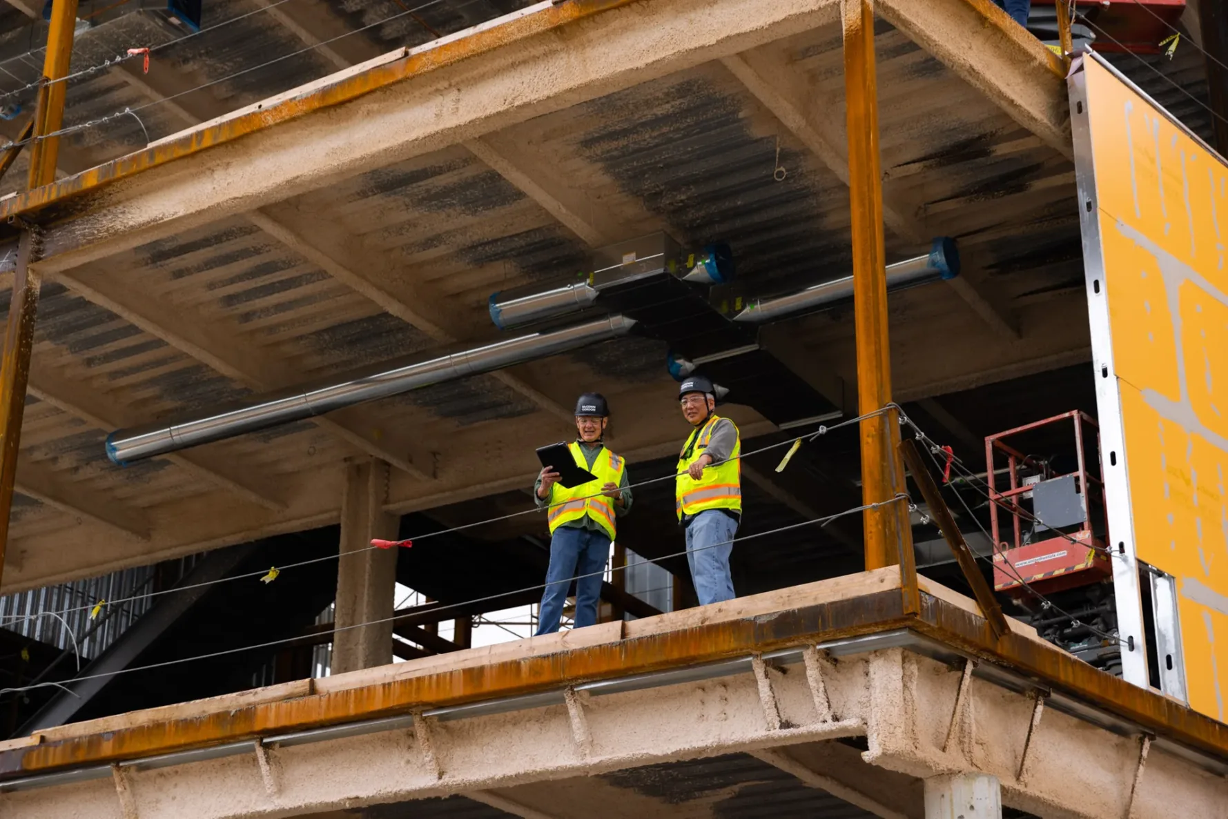 Two McCownGordon associates collaborating on a construction site