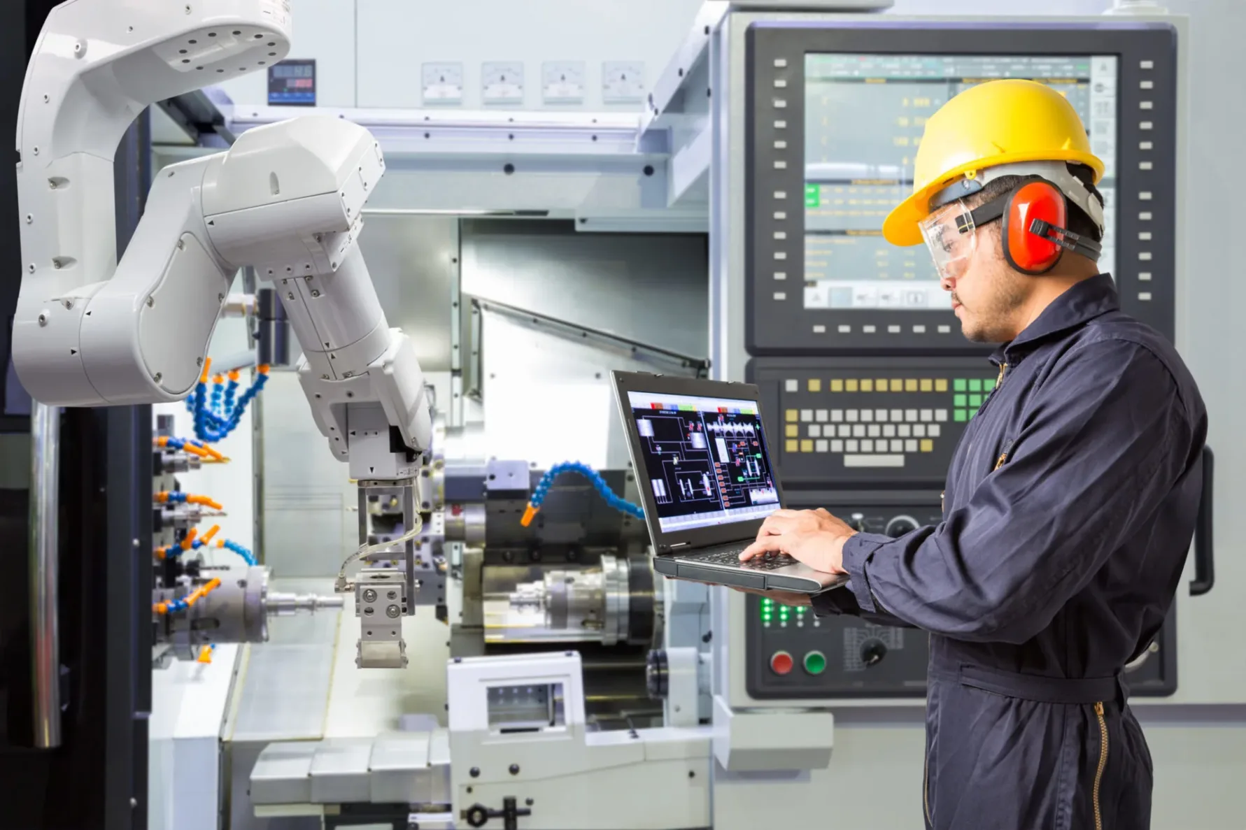 Man performing a manufacturing facility automation audit, a service McCownGordon offers to maximize efficiencies.
