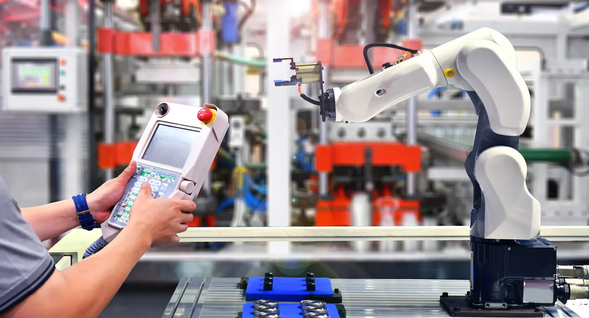 Engineer check and control automation Robot arm machine for Aluminum cans food packing process in factory.