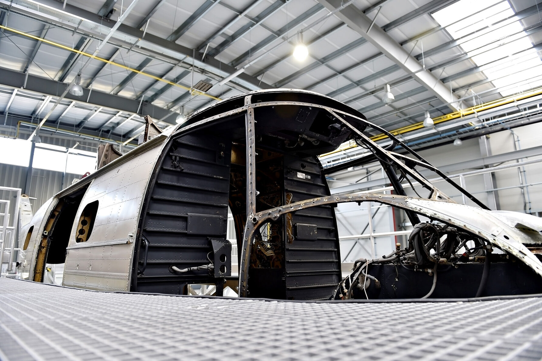 Detail with helicopter fuselage on the repair line in a factory