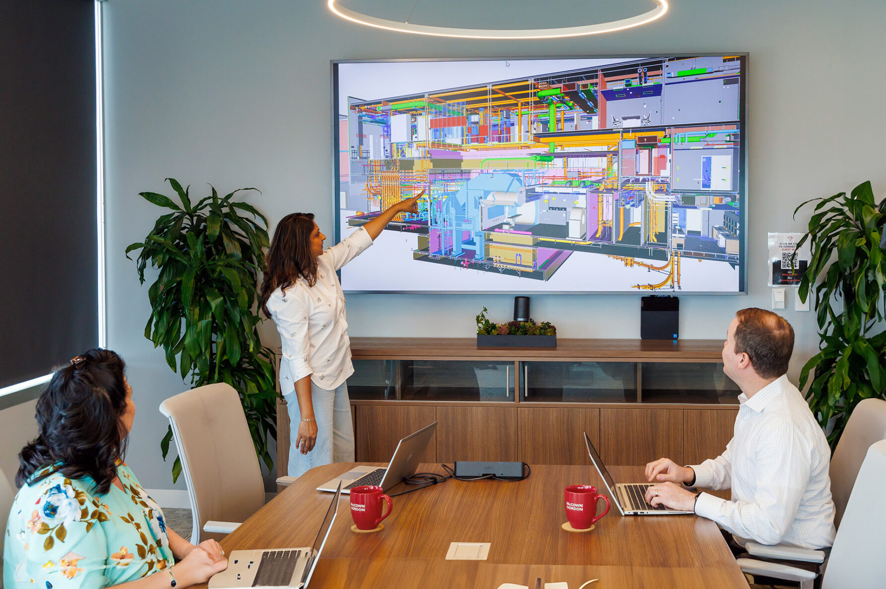 McCownGordon associate pointing to a Building Information Model.