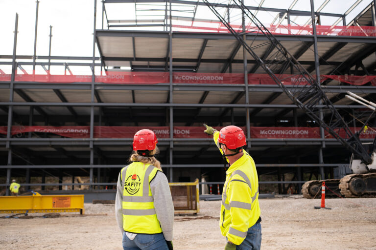 McCownGordon associates talking on jobsite.