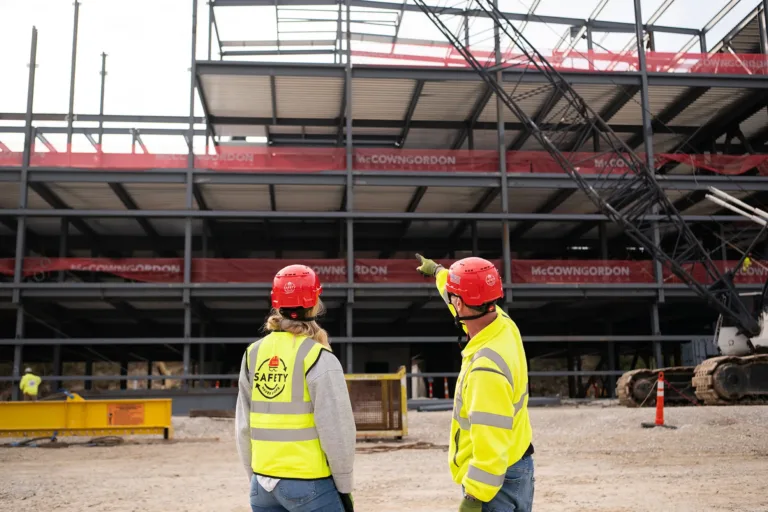 McCownGordon associates talking on jobsite.